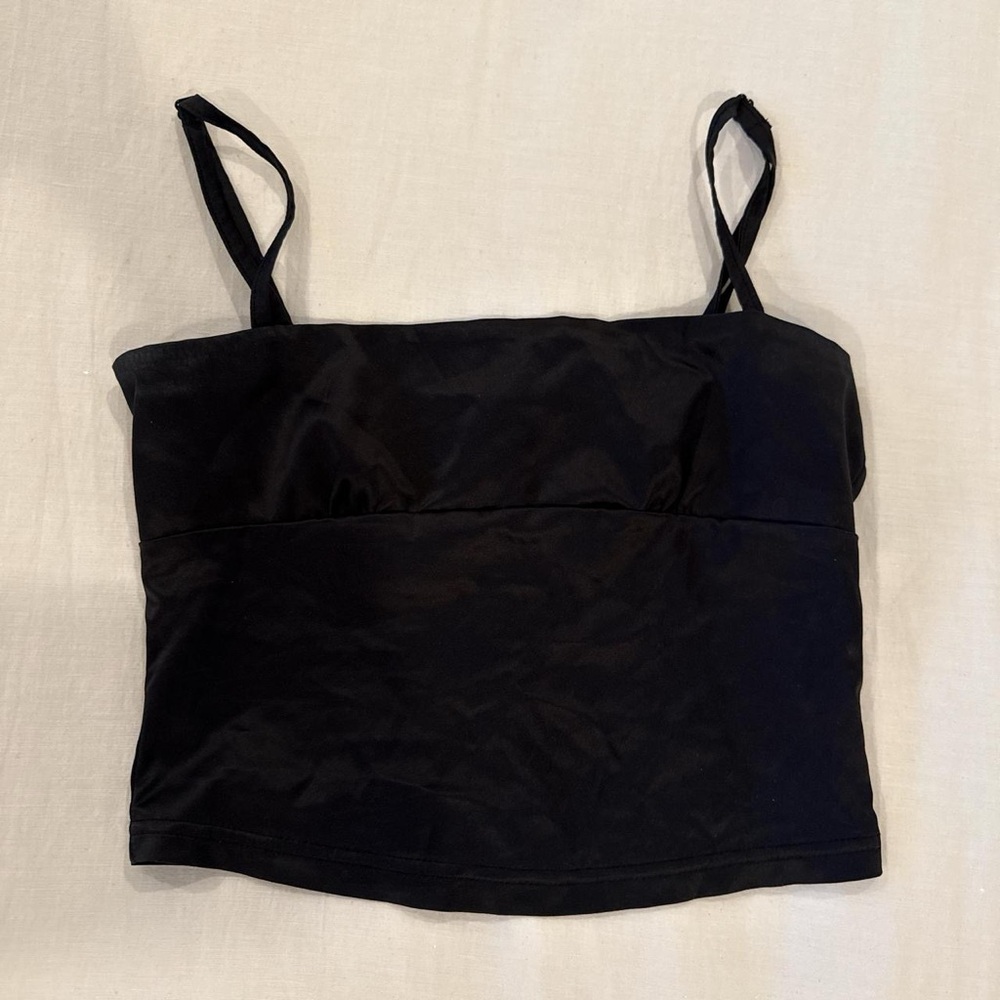 Black going out top